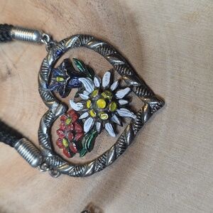 Tracht necklace with an edelweiss and gentian flower heart pendant.